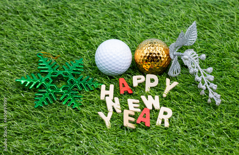 Naklejka premium Golf Happy Ne Year with golf ball and word on green grass