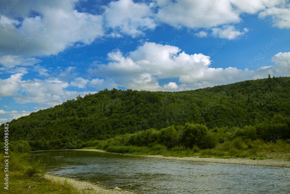 Carpathian mountains beautiful landscape environment space scenic view green trees cover of hill and river stream in summer clear weather day time