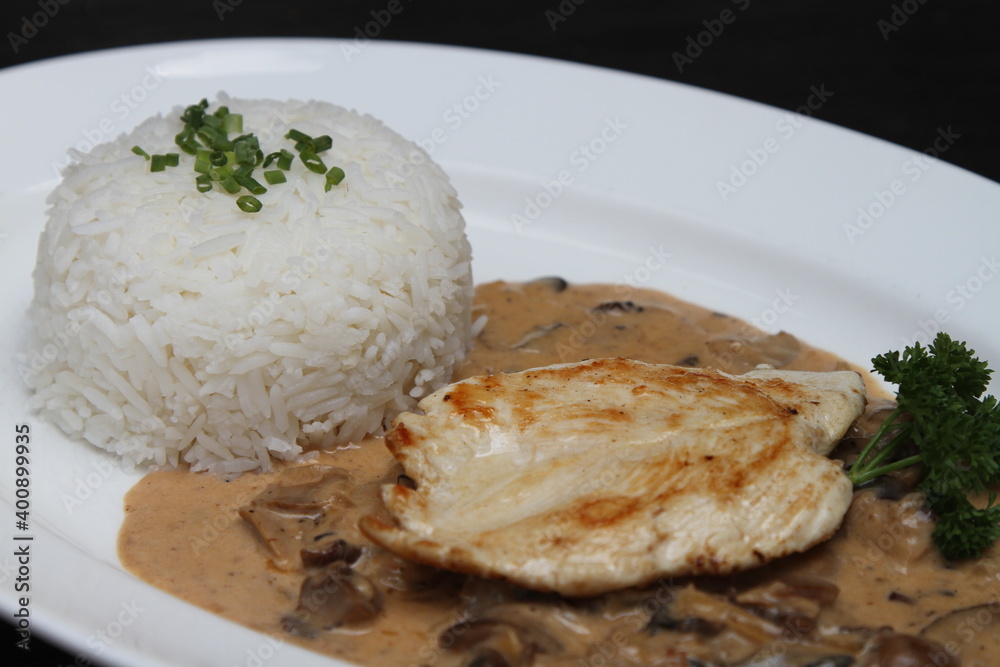 Chicken breast with mushroom sauce and steamed rice Chicken breast with mushroom sauce and steamed rice
