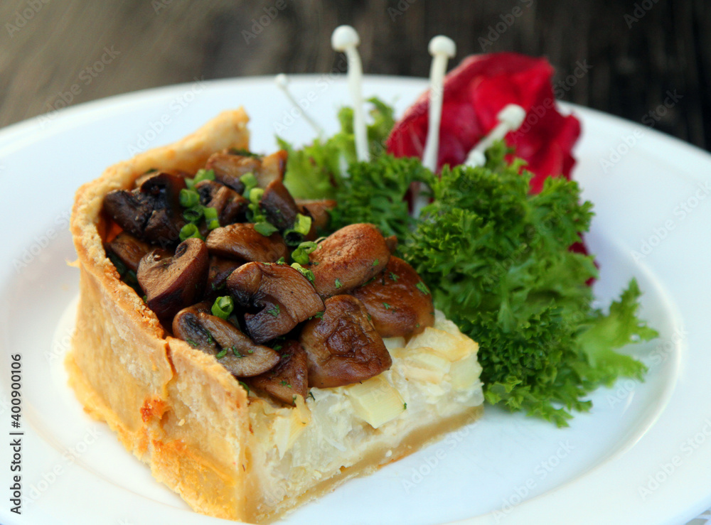 Asparagus onion quiche with salad garnish Asparagus onion quiche with salad garnish