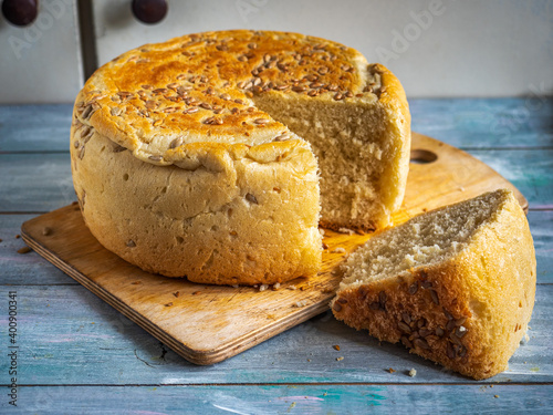 Homemade freshly baked bread in a cut top view on a kitchen board