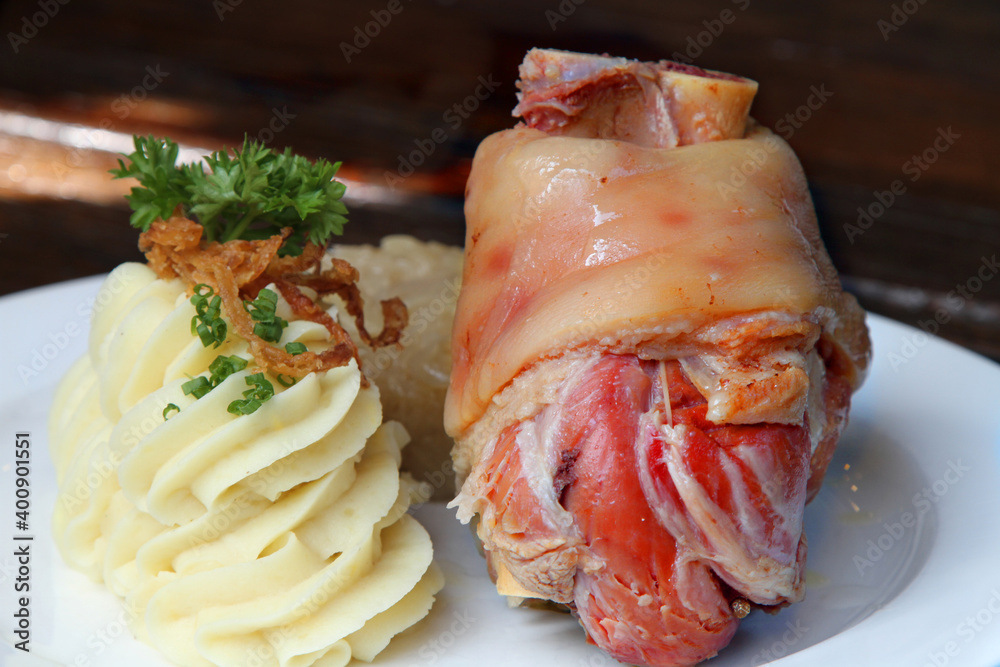 Eisbein, German pickled and cured ham hock served with potato mash and