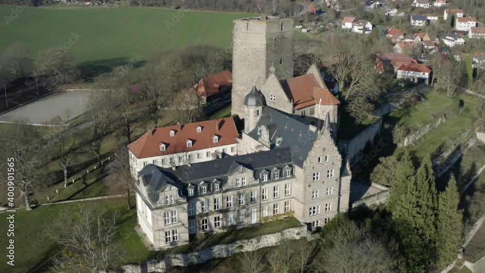 Drone aerial view of the fairytale castle Adelebsen on a beautiful autmn afternoon in golden sunlight. Adelebsen is a historic medieval town Flecken near Göttingen in Niedersachsen, Germany. Drone aerial view of the fairytale castle Adelebsen on a beautiful autmn afternoon in golden sunlight. Adelebsen is a historic medieval town Flecken near Göttingen in Niedersachsen, Germany.