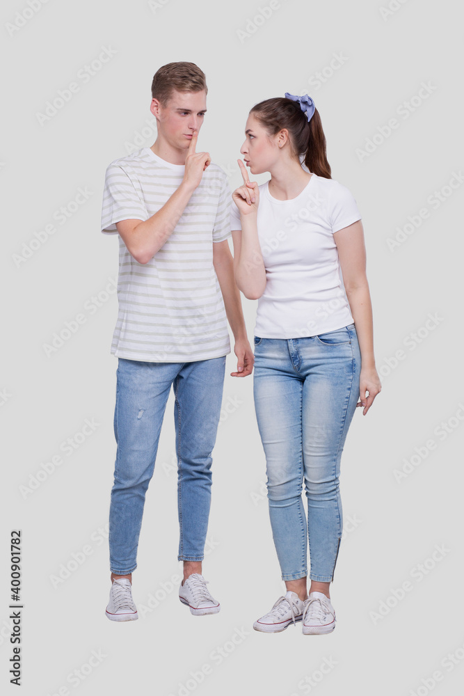Couple Silence Sign. Couple Shush. Couple Standing Isolated Looking at Each Other Couple Silence Sign. Couple Shush. Couple Standing Isolated Looking at Each Other