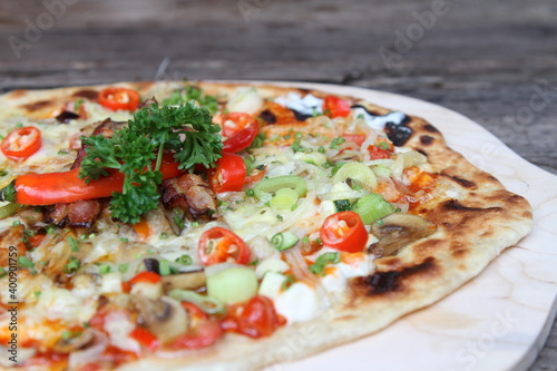 German pizza "Flammkuchen" spicy style with chillies