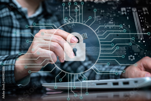The hand of a person using a USB memory. Cyber Information Protection Concept.