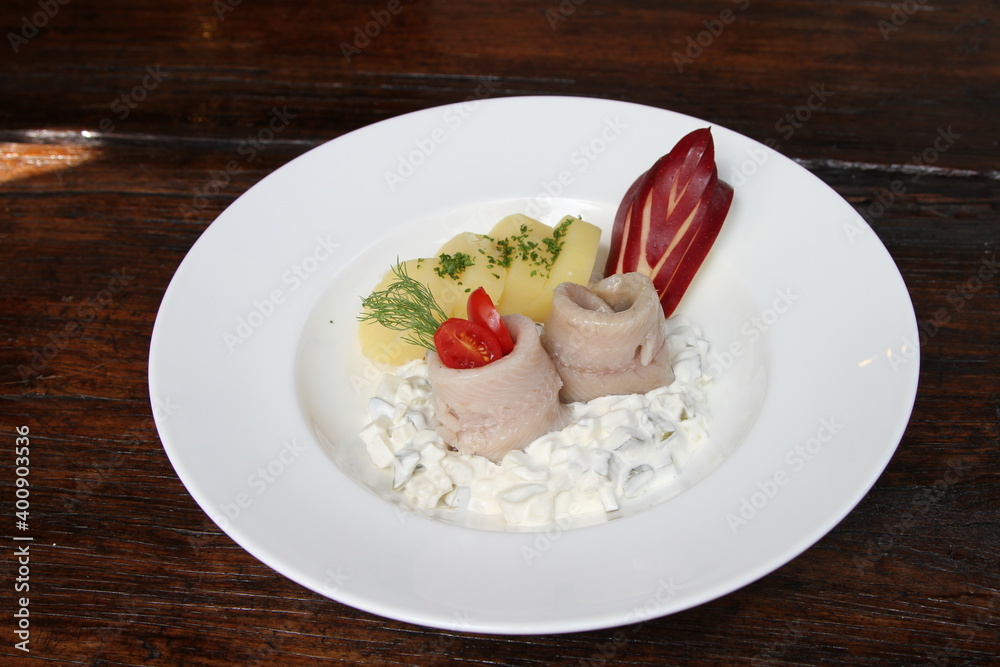 Variations of herring Salad and fillets. Served with parsley potatoes Variations of herring Salad and fillets. Served with parsley potatoes