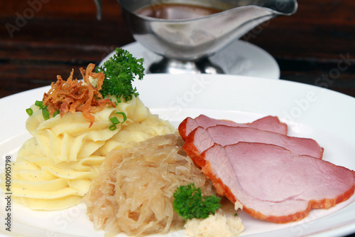 South German smoked and cured pork shoulder called Schäufele, served with sauerkraut, potato mash and gravy