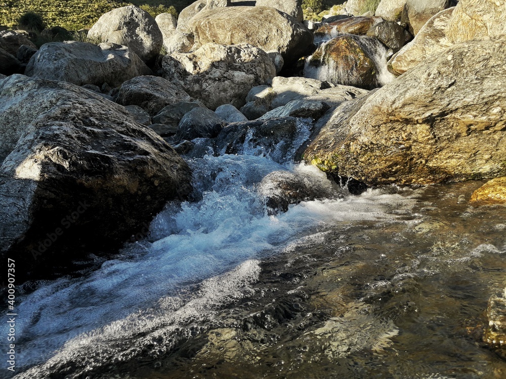 water flowing over rocks water flowing over rocks