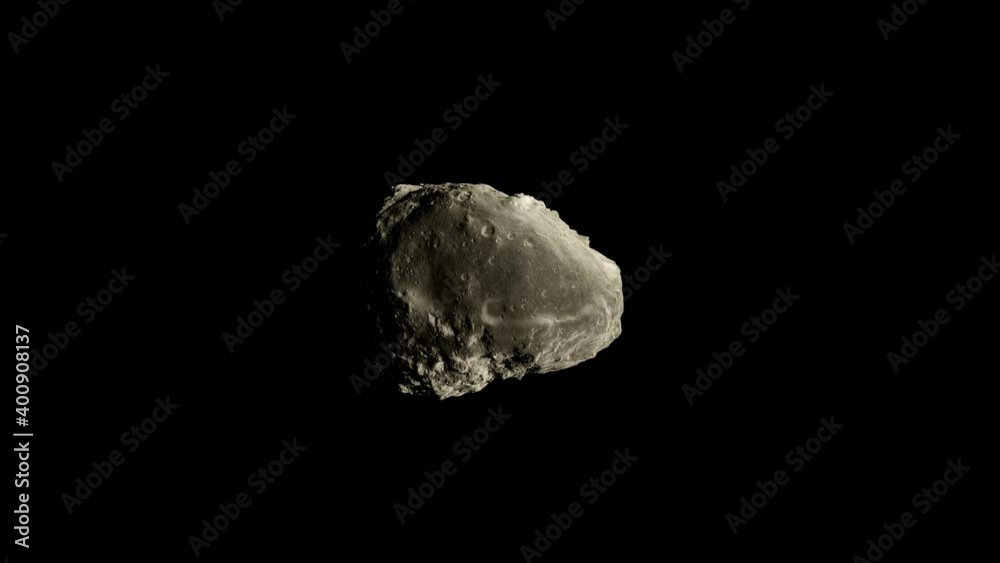 An isolated asteroid, floating in orbit, spinning on an isolated black background for compositing An isolated asteroid, floating in orbit, spinning on an isolated black background for compositing