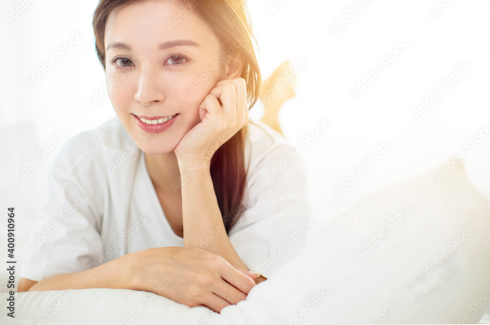 beautiful Asian young woman relaxing on bed beautiful Asian young woman relaxing on bed