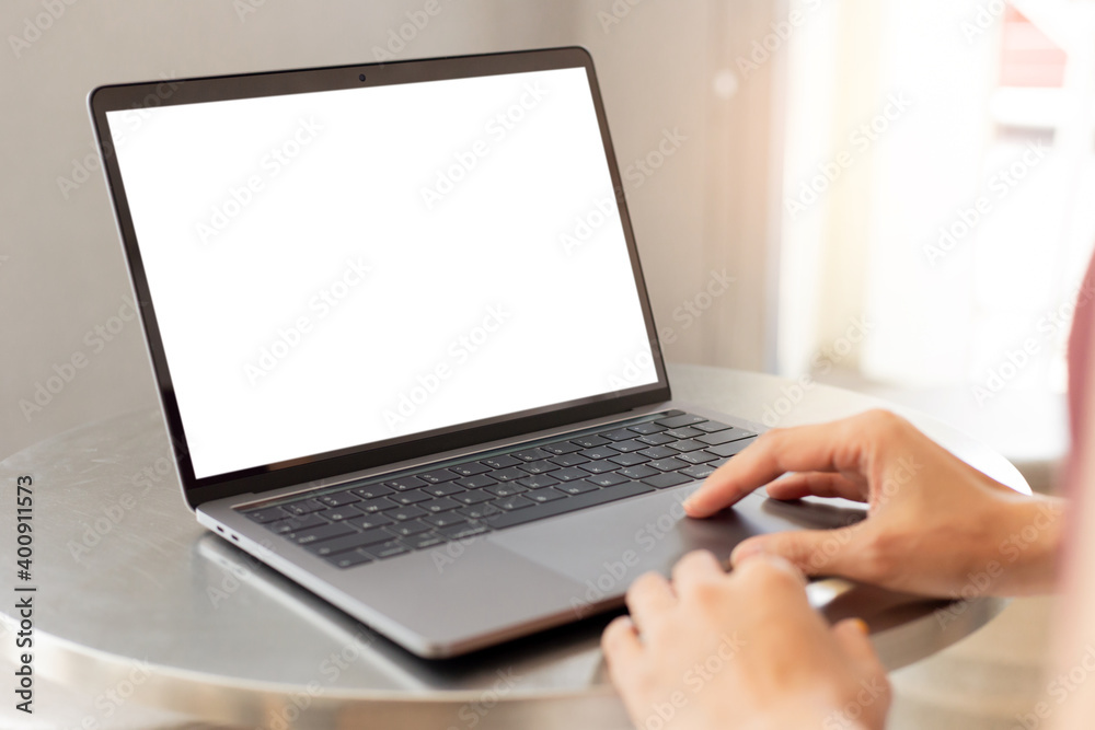 computer screen blank mockup.hand woman work using laptop with white background for advertising,contact business search information on desk at coffee shop.marketing and creative design computer screen blank mockup.hand woman work using laptop with white background for advertising,contact business search information on desk at coffee shop.marketing and creative design