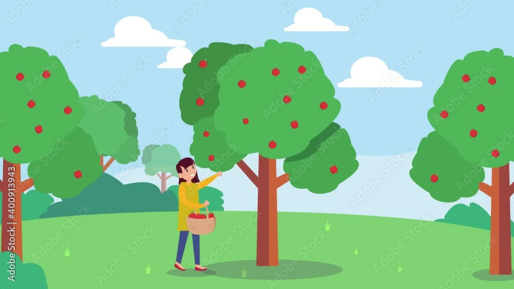 Little girl harvesting ripe apples on the tree