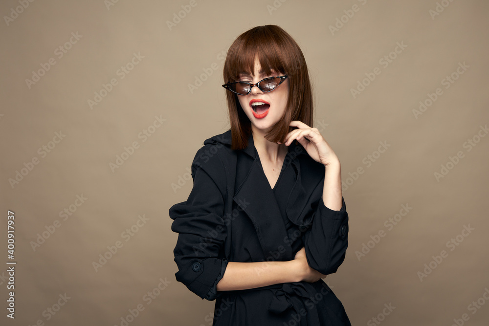 Luxurious woman classic coat good mood posing studio 