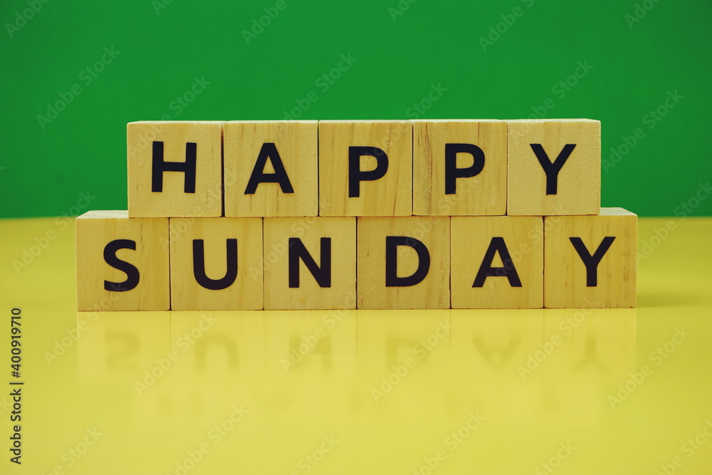 Happy Sunday alphabet letter on green and yellow background Happy Sunday alphabet letter on green and yellow background