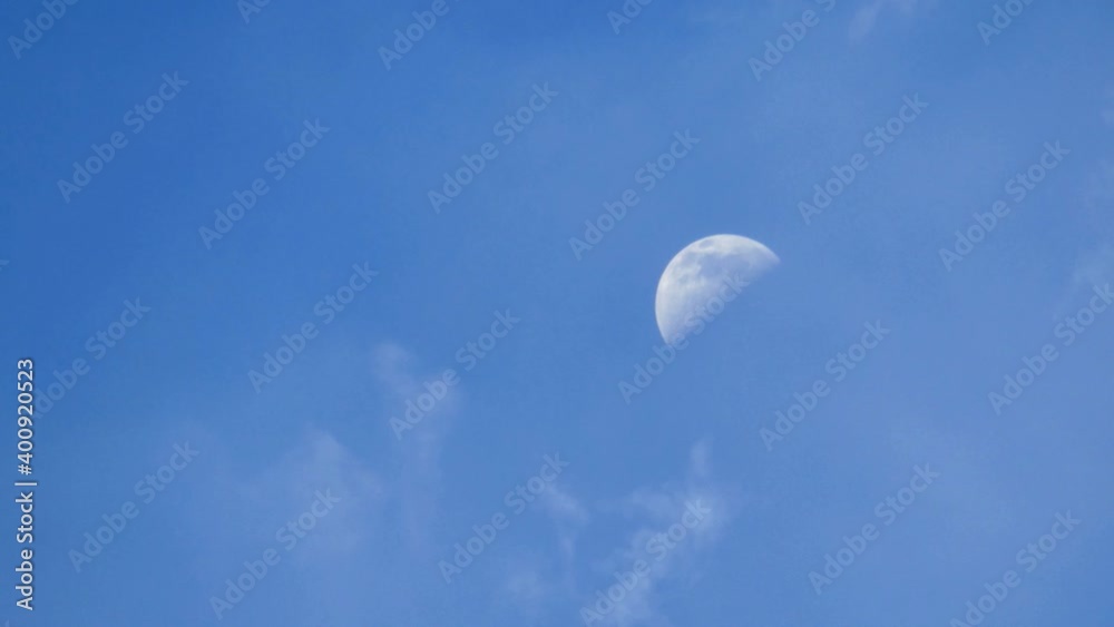 Half moon in the blue sky time lapse. Satellite of planet earth. Half moon in the blue sky time lapse. Satellite of planet earth.