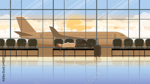 Overwork tired office man lay down sleep on the seat in the international airport terminal at early morning sunrise. Exhausted people from business trips. City lifestyle of work hard and burn out man.