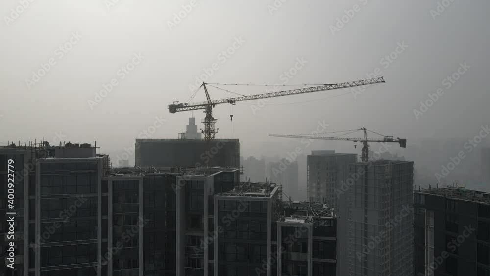 Construction site in heavy haze air pollution, downtown city building in fog. Environmental conservation, business, industry concept b-roll footage. Highly polluted air and cityscape of Shanghai China Construction site in heavy haze air pollution, downtown city building in fog. Environmental conservation, business, industry concept b-roll footage. Highly polluted air and cityscape of Shanghai China