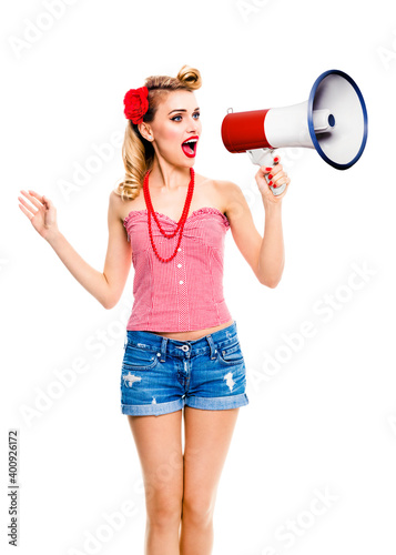 Excited blond woman holding megaphone and shout. Girl in pin up style, isolated over white background. Caucasian model with open mouth in retro vintage studio concept.
