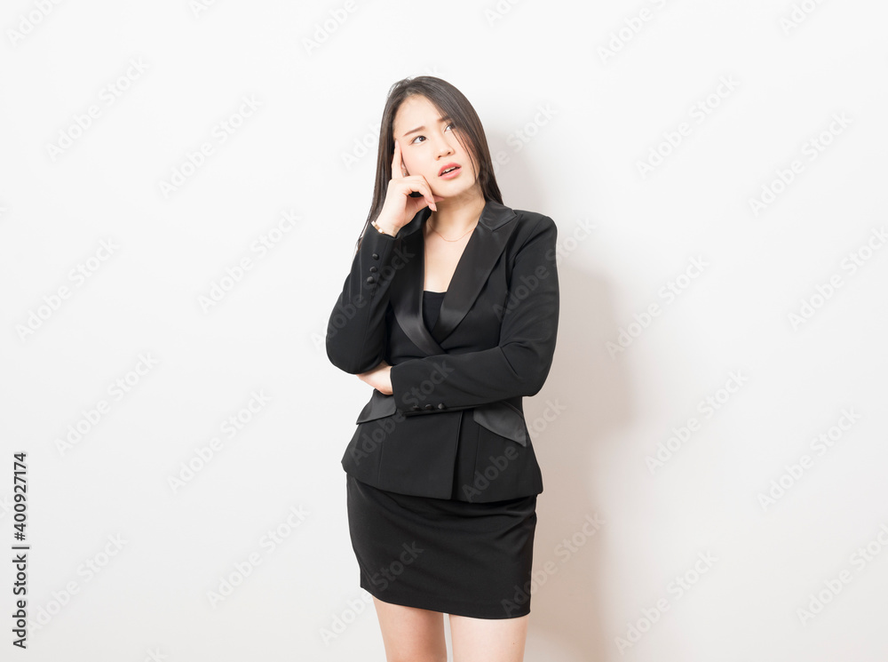 Asian business woman with hands on face suffering from severe depression on white background. Unemployment and layoff concept. Asian business woman with hands on face suffering from severe depression on white background. Unemployment and layoff concept.
