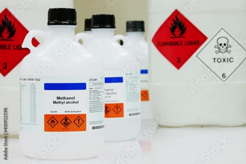 Bottle of Methanol, methyl alcohol, MeOH with Properties information and Variety type of chemical containers with its chemical hazard warning symbols. Flammable warning symbol, Toxic warning symbol. photo