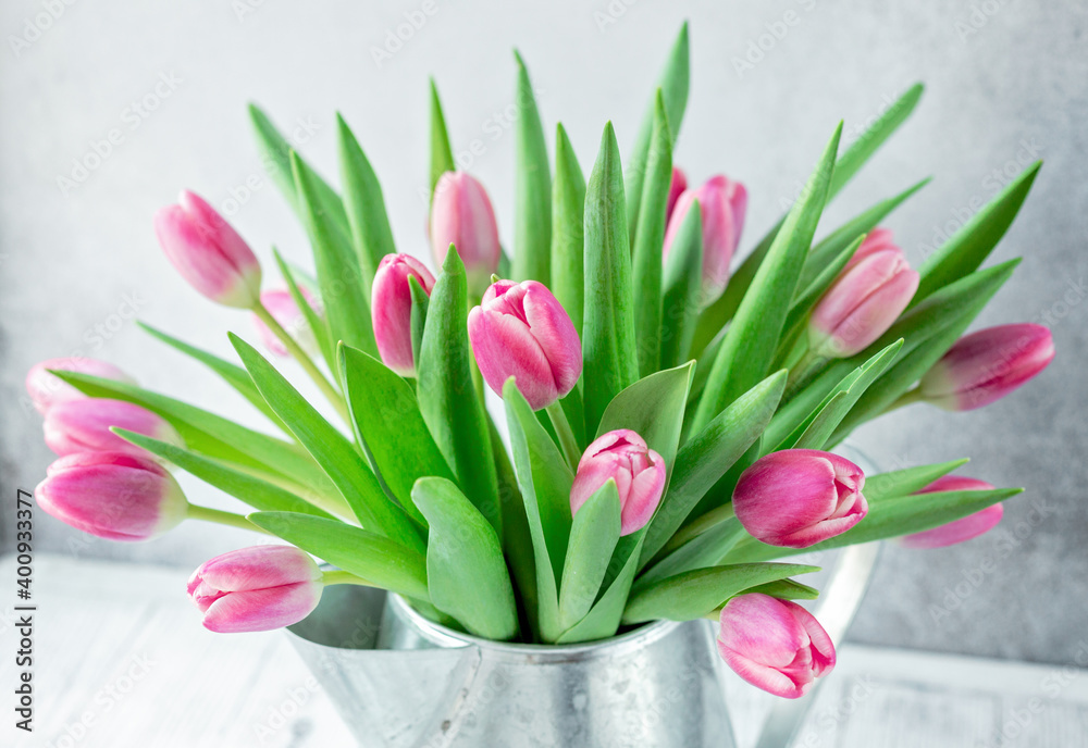 Fototapeta premium Spring floral background. Pink tulip flowers bouquet on on the windowsill. Copy space