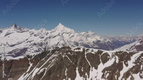 High definition drone aerial video flying high over Swiss Alps near Zermatt, Switzerland.