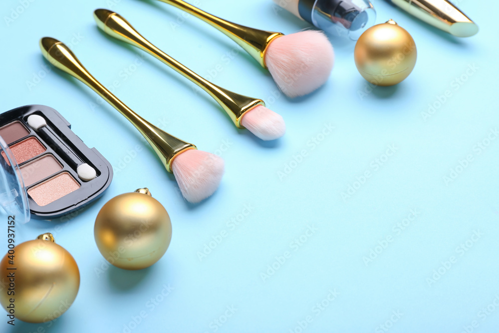 Christmas composition with cosmetics on color background Christmas composition with cosmetics on color background