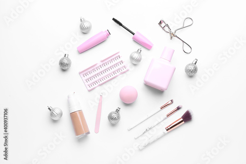 Christmas composition with cosmetics on white background