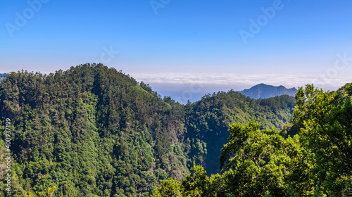 Beautiful mountain landscape from the Levada Ribeiro Frio - Portela. Clouds in the background.