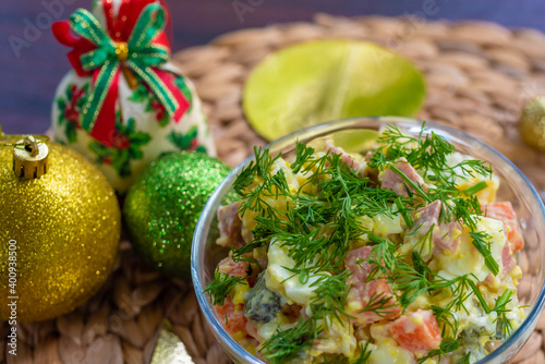 close up top view, traditional russian new year and christmas olivier salad decorated with parsley, new year and christmas celebration in thailand, vegetarian and vegan egg