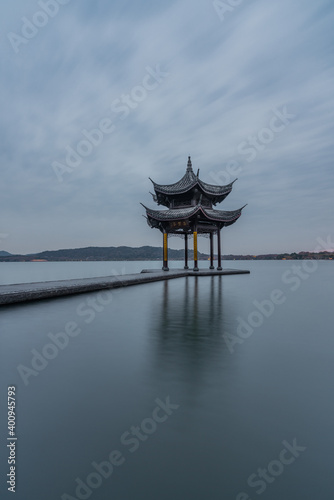 Sunset view of Jixian pavilion, the landmark at the west lake in Hangzhou, China.