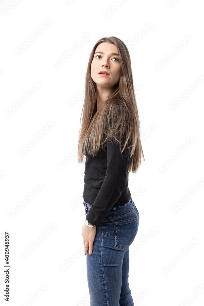 Beautiful young woman looking up with concerned expression. Beautiful young woman looking up with concerned expression.