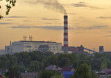 Thermal station with a Smoking chimney at sunset