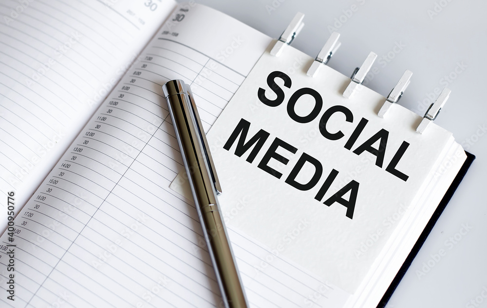 text SOCIAL MEDIA on the short note texture background with pen text SOCIAL MEDIA on the short note texture background with pen