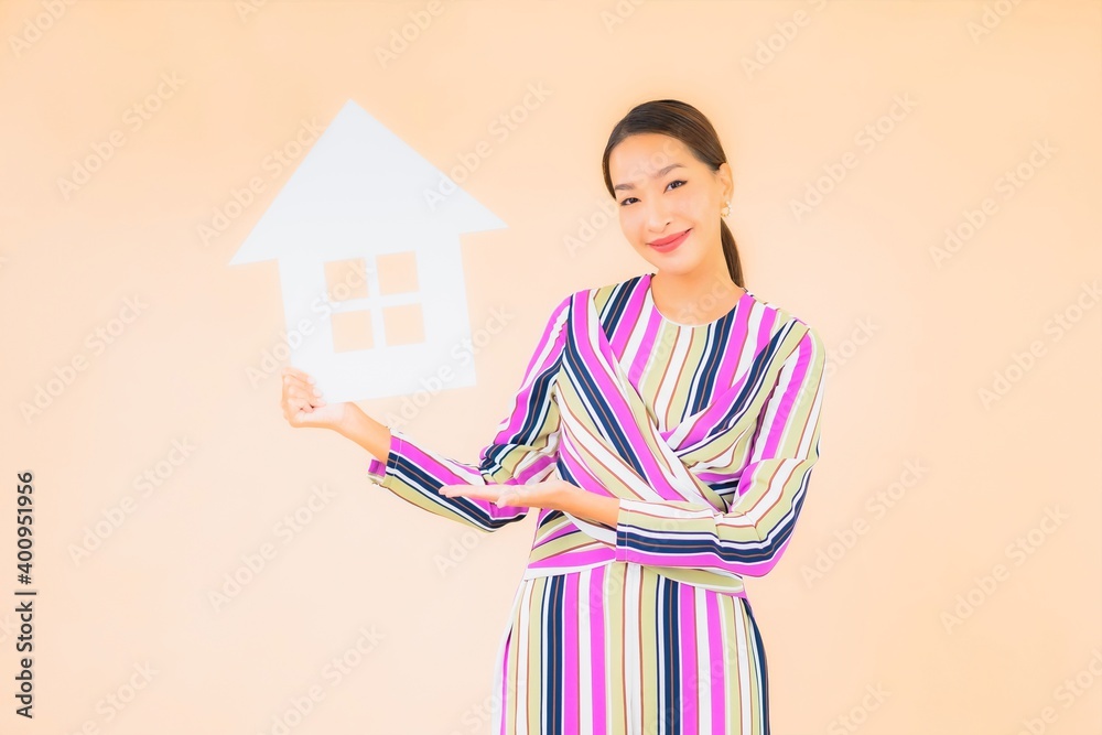 Portrait beautiful young asian woman with home or house sign paper Portrait beautiful young asian woman with home or house sign paper