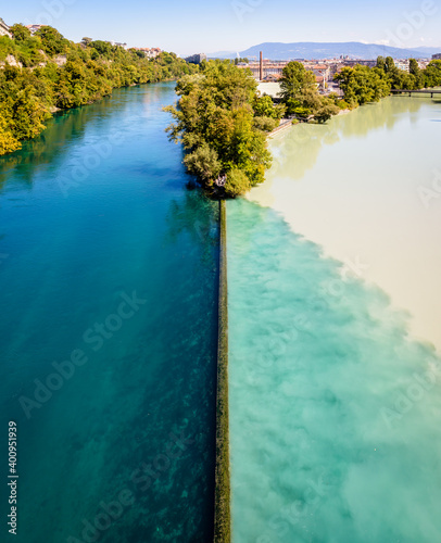 The Junction is the name of the confluence where the emerald blue waters of the Rhone river and the yellowish silty waters of the Arve river blend in Geneva, Switzerland.