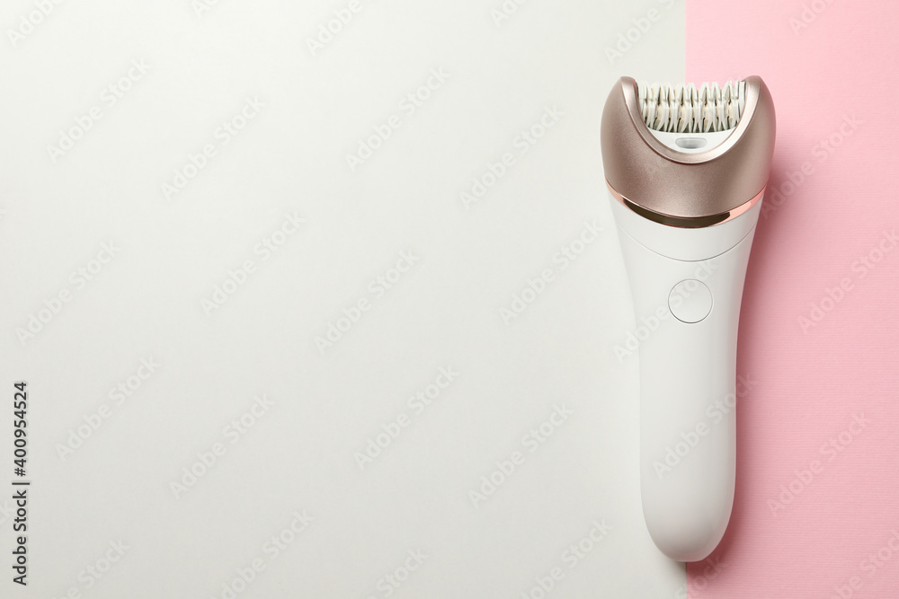 Epilator on two tone background, space for text Epilator on two tone background, space for text