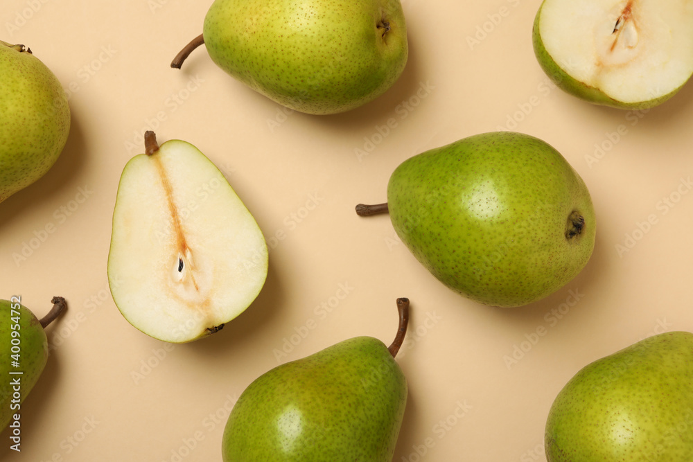 Fresh green pears on beige background, top view Fresh green pears on beige background, top view