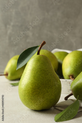 Tray with green pears on white textured background