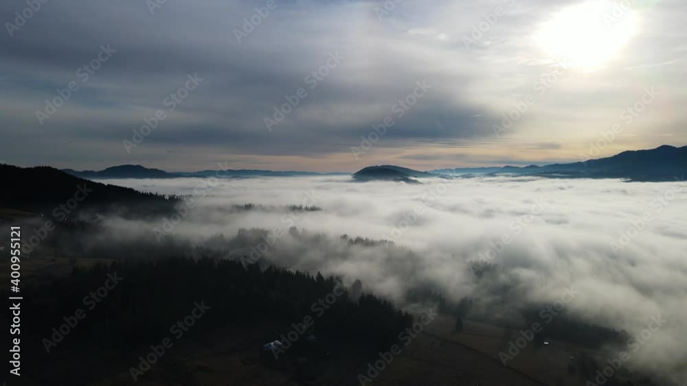Flying through the clouds above mountain tops. High peaks wonderful morning sunrise natural Landscape Flying through the clouds above mountain tops. High peaks wonderful morning sunrise natural Landscape