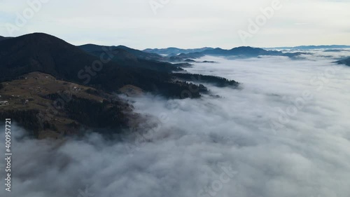 Wallpaper Mural Flying through the clouds above mountain tops. High peaks wonderful morning sunrise natural Landscape Torontodigital.ca