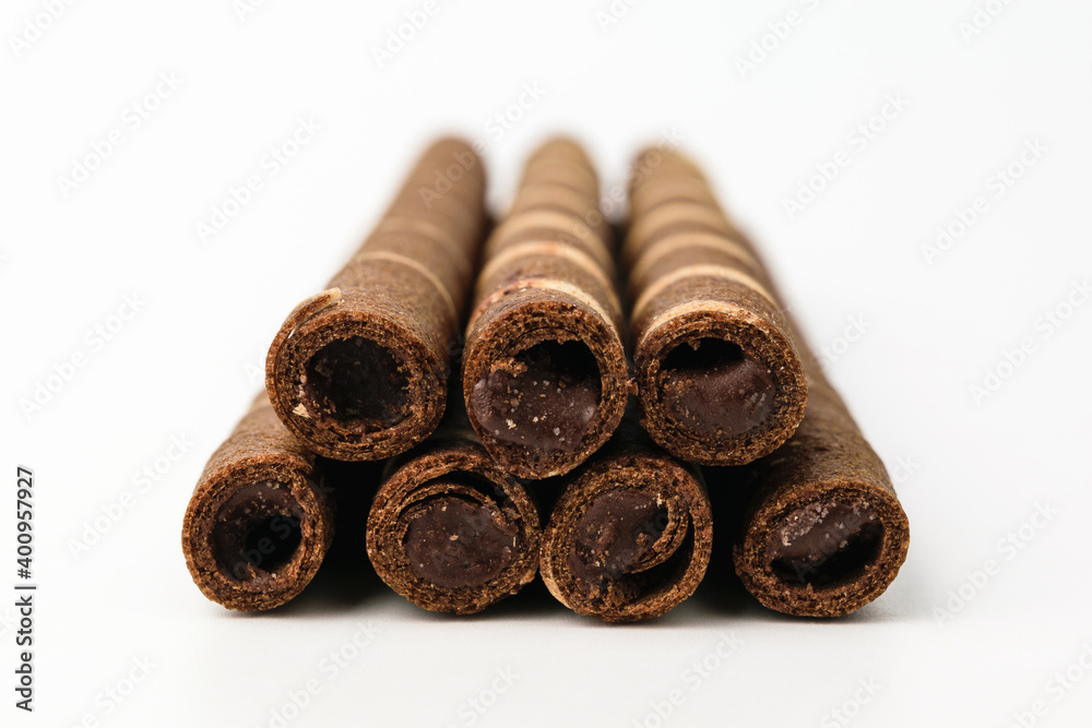 Chocolate wafer rolls on a white background