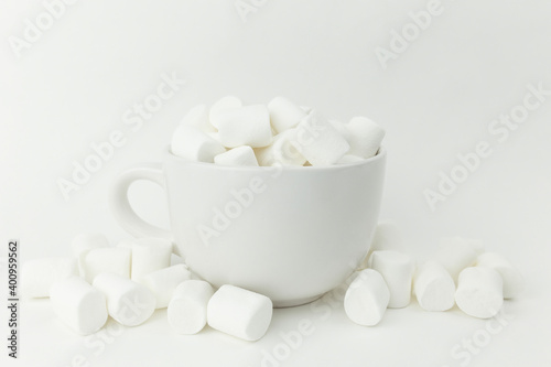 Marshmallow in the cup on the white background