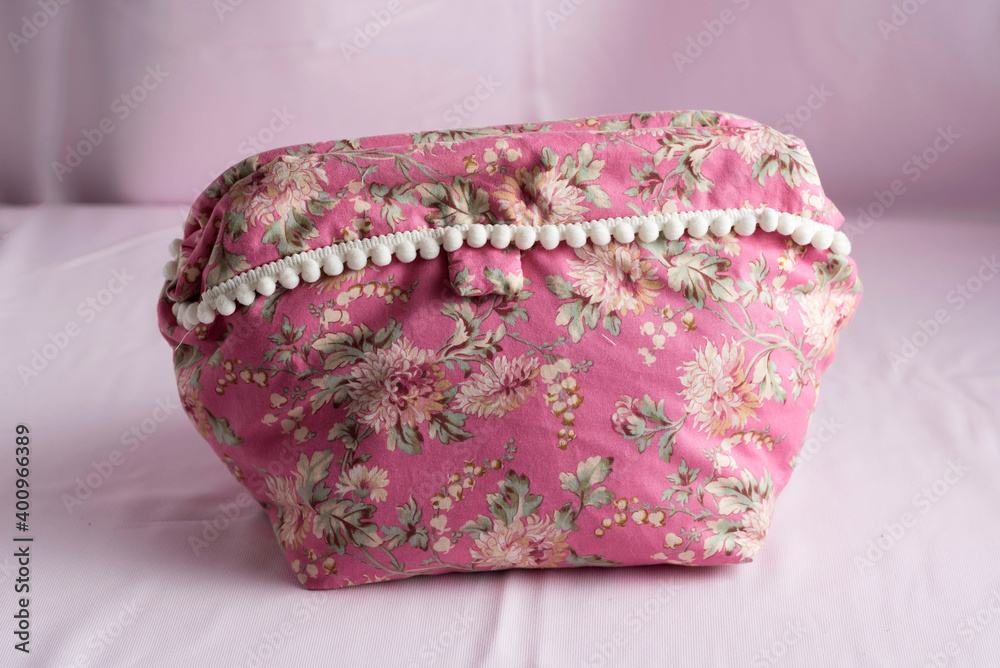 Closeup of a pink floral fabric purse Closeup of a pink floral fabric purse