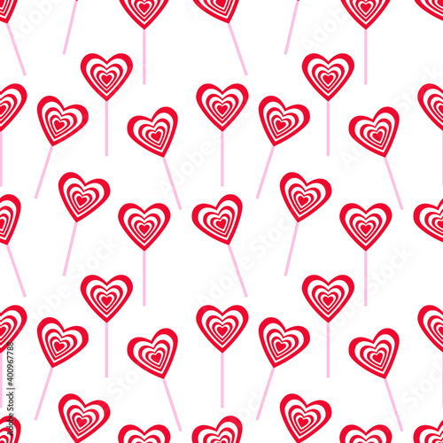 vector seamless pattern with lollipops in a shape of heart on a white background