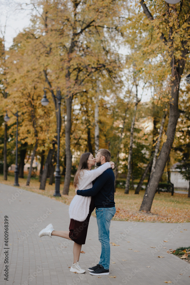 Young adult couple in love in autumn Park Young adult couple in love in autumn Park