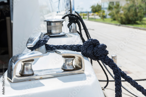 Photography Detail of an anchor rope on a yacht, Stainless steel boat mooring cleat with kno