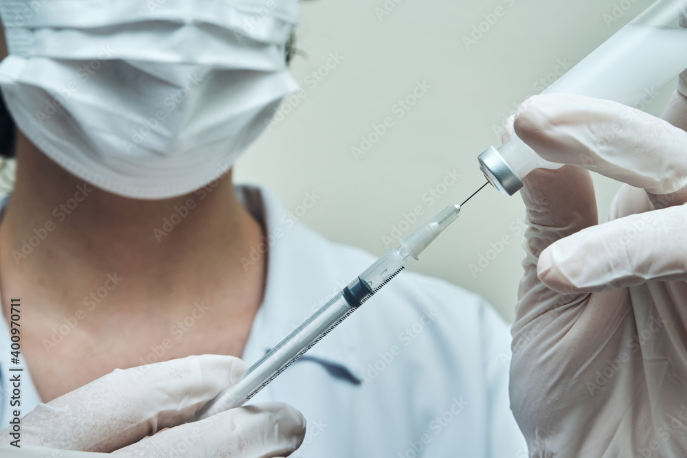 View of a Nurse preparing vaccine dose View of a Nurse preparing vaccine dose