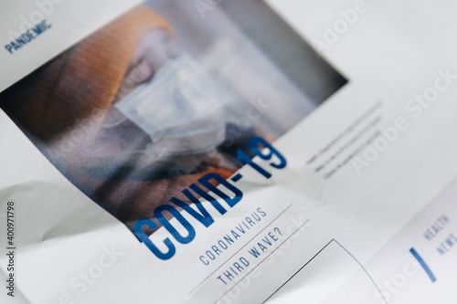 Obraz na płótnie Newspaper with precaution about third wave of coronavirus covid-19 pandemic w salonie